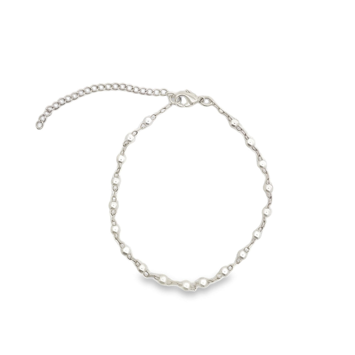 A delicate silver beaded chain anklet rests against a plain white background, featuring a lobster clasp and an adjustable extension chain.