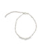 A delicate silver beaded chain anklet rests against a plain white background, featuring a lobster clasp and an adjustable extension chain.