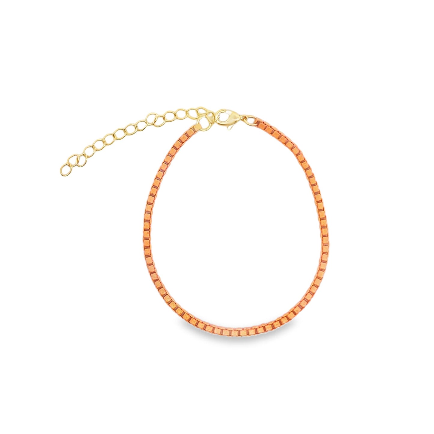A delicate peach-colored beaded anklet features a shiny gold lobster clasp and an adjustable chain extension.