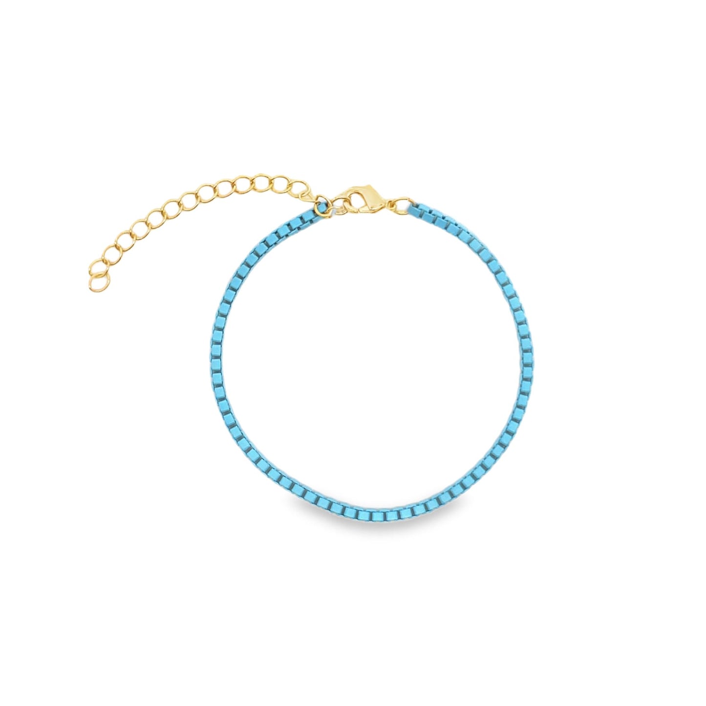 A delicate gold chain bracelet features vibrant turquoise square beads and an adjustable extender clasp.