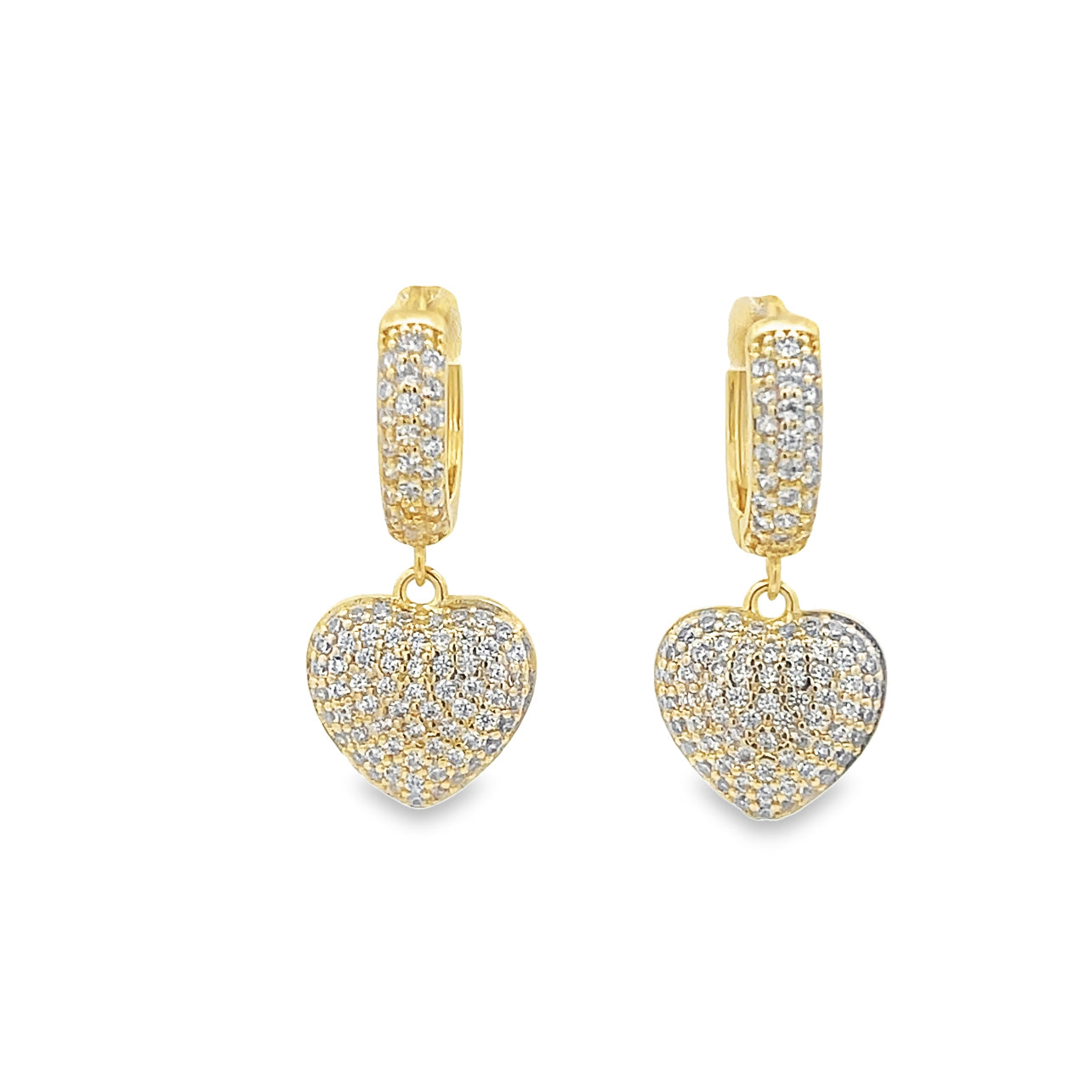 A pair of gold huggie hoop earrings featuring pavé-set diamond heart charms sparkles against a white background.