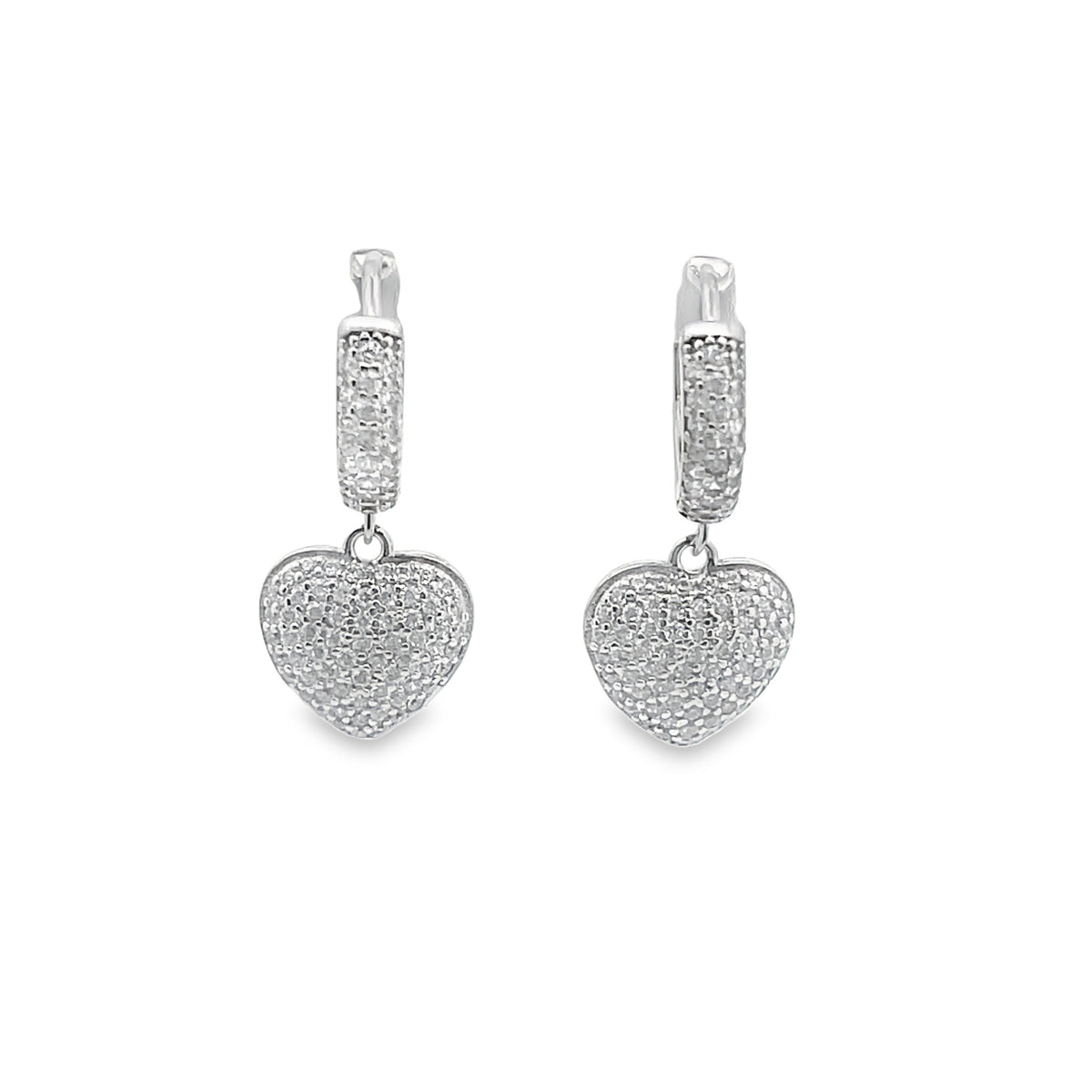 A pair of sparkling silver heart-shaped hoop earrings pave-set with cubic zirconia crystals glistens against a plain white background.