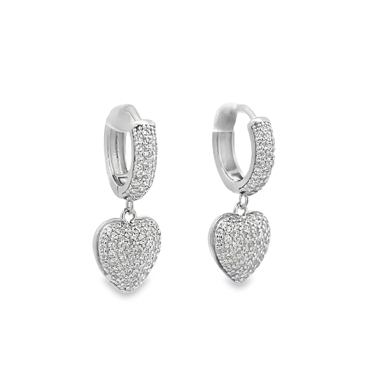 A pair of silver hoop earrings features sparkling pavé-set crystals and dangling heart-shaped charms.