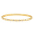 A gold bangle bracelet sparkles with evenly spaced diamonds flush-set along its polished surface.