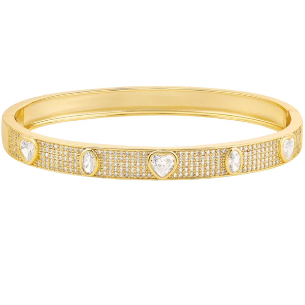 A gold hinged bangle bracelet sparkles with pavé-set crystals and alternates between heart and oval gemstones.