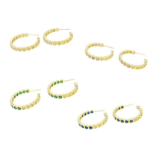 Four pairs of gold hoop earrings feature colorful heart-shaped stones in clear, pink, green, and blue on a white background.