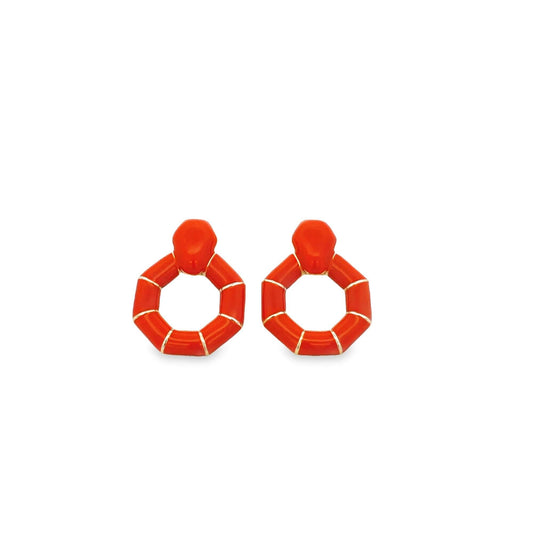 A pair of vibrant orange geometric drop earrings features segmented circular hoops with delicate gold accents.