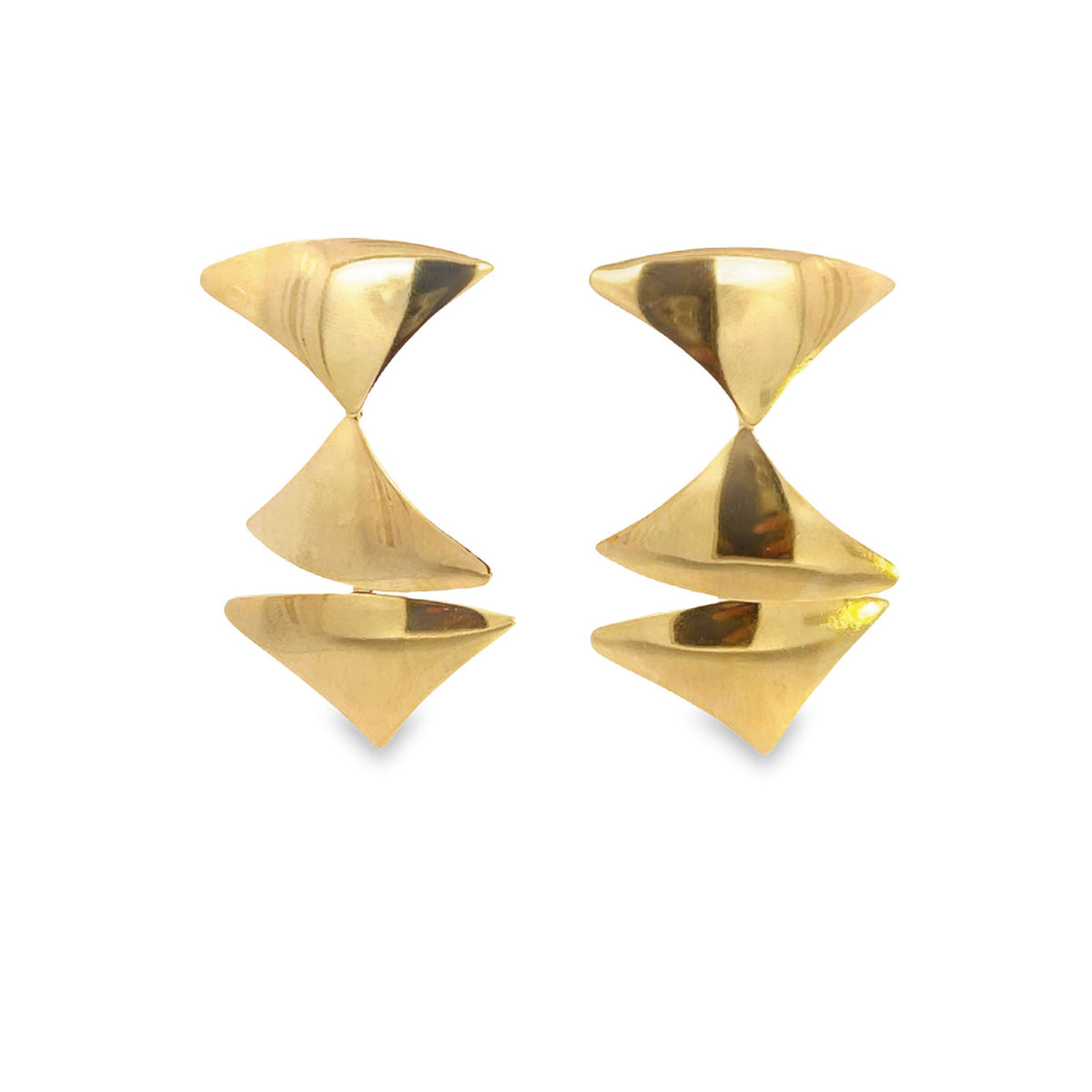 A pair of geometric gold drop earrings features stacked triangular shapes against a clean white background.
