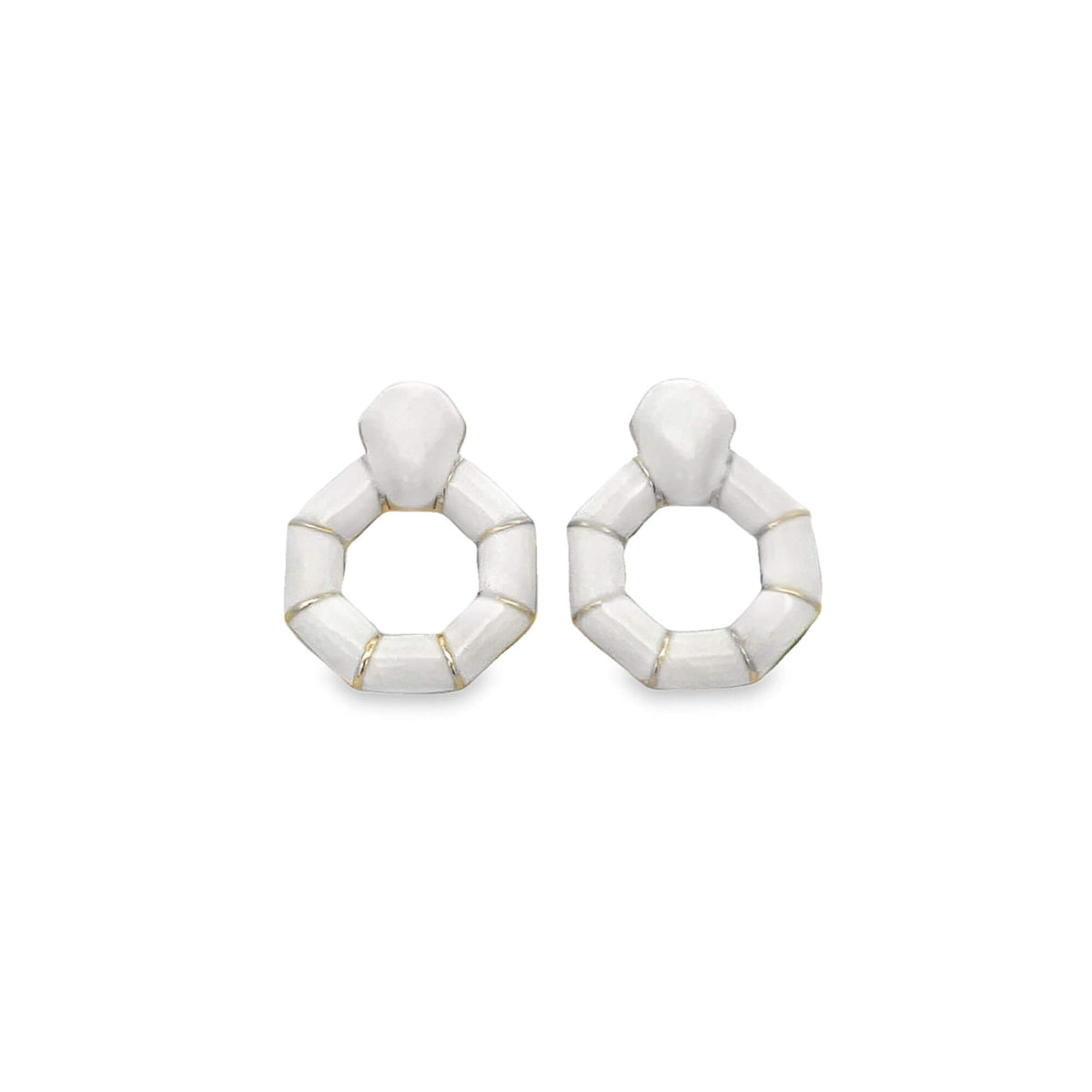 A pair of geometric white enamel hoop earrings featuring segmented bamboo-style designs with gold accents rests against a clean white background.