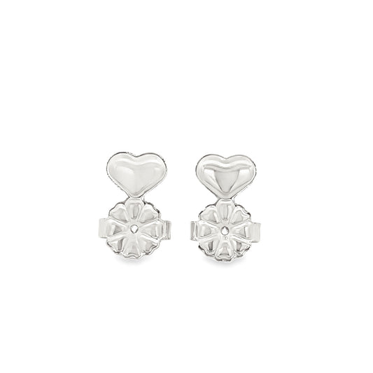 Two silver-toned heart-shaped locking earring lifters display intricate floral backing details against a plain white background.