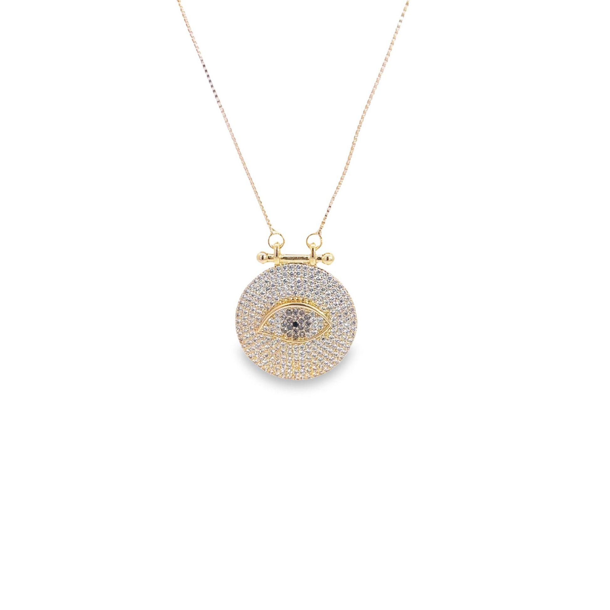 A delicate gold evil eye pendant necklace sparkles with pavé diamonds against a white background.