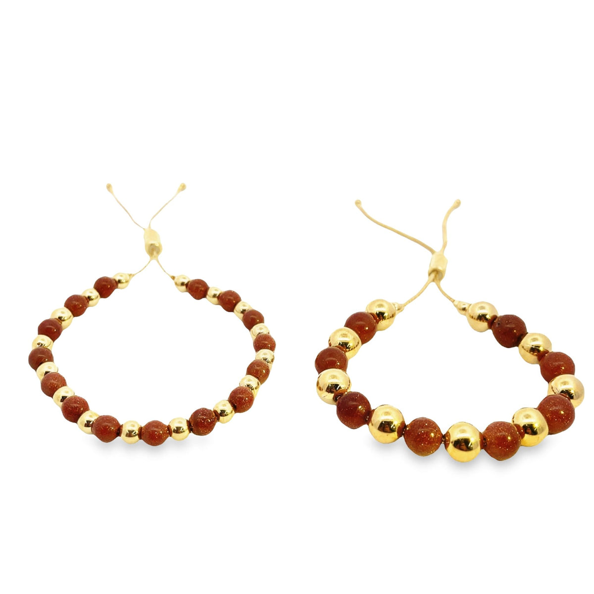 Two adjustable gemstone beaded bracelets featuring alternating gold metal beads and sparkling brown sunstone beads rest against a white background.