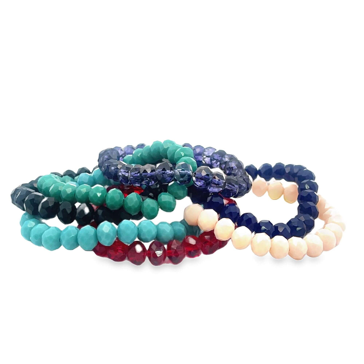 A colorful pile of faceted bead bracelets in turquoise, red, blue, and pink rests against a white background.