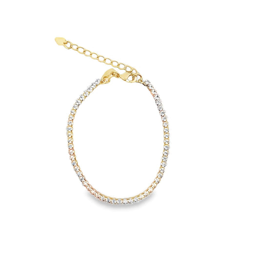 A delicate tri-color gold tennis bracelet sparkles with cubic zirconia stones against a clean white background.