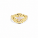 Elegant bee signet ring featuring a genuine Mother of Pearl inlay. Available in Gold Filled and Rhodium finishes with a timeless oval design perfect for everyday wear.