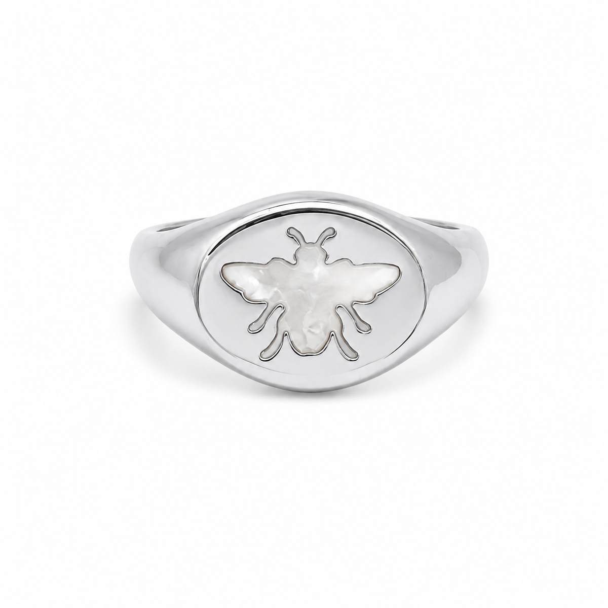 A silver signet ring features an engraved bee motif inlaid with mother-of-pearl.