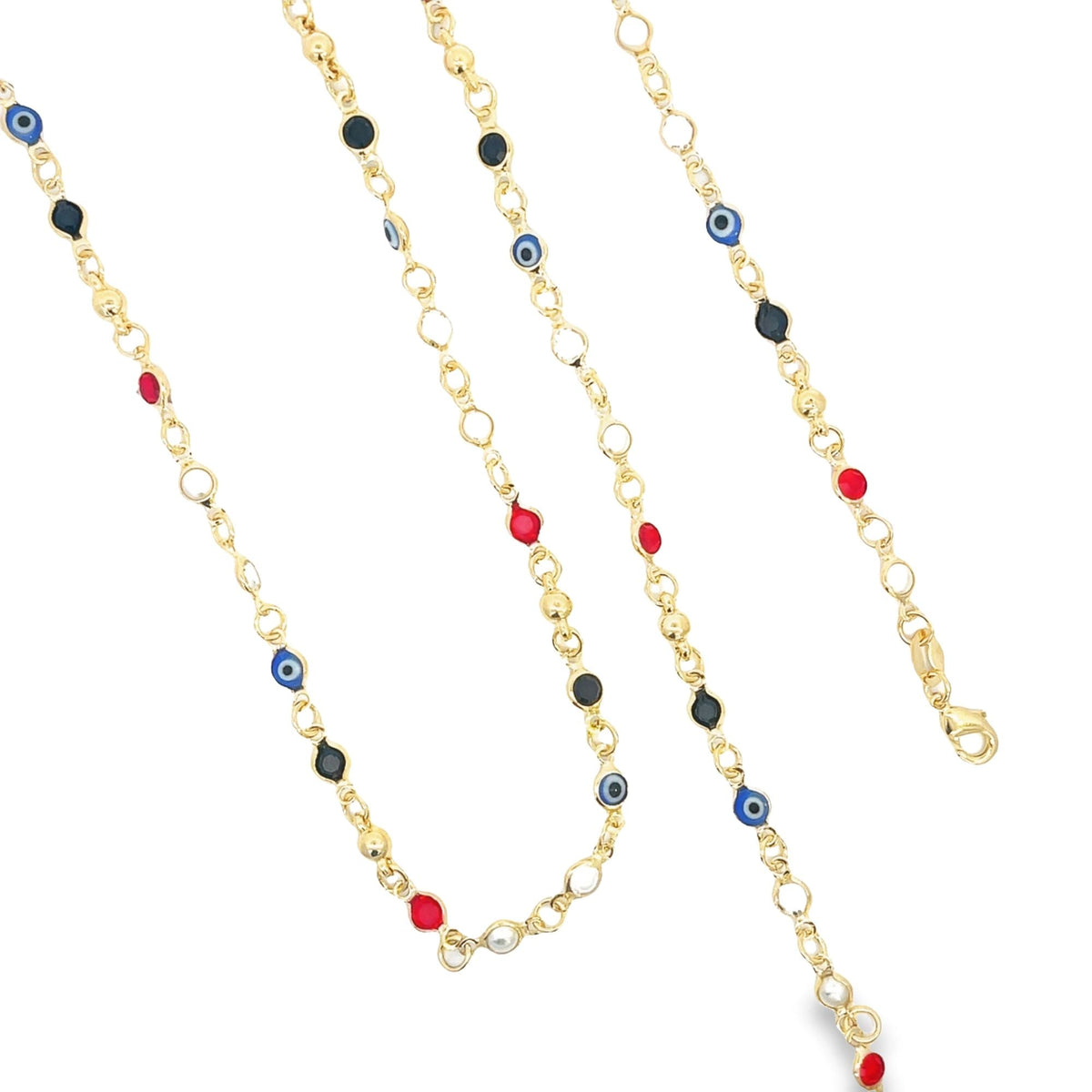 Three strands of gold chain jewelry feature colorful evil eye charms and red, black, and white beads against a white background.
