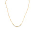 A delicate gold beaded necklace drapes against a clean white background.