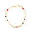 A delicate gold link bracelet features colorful enamel beads, including red stones and blue evil eye charms.