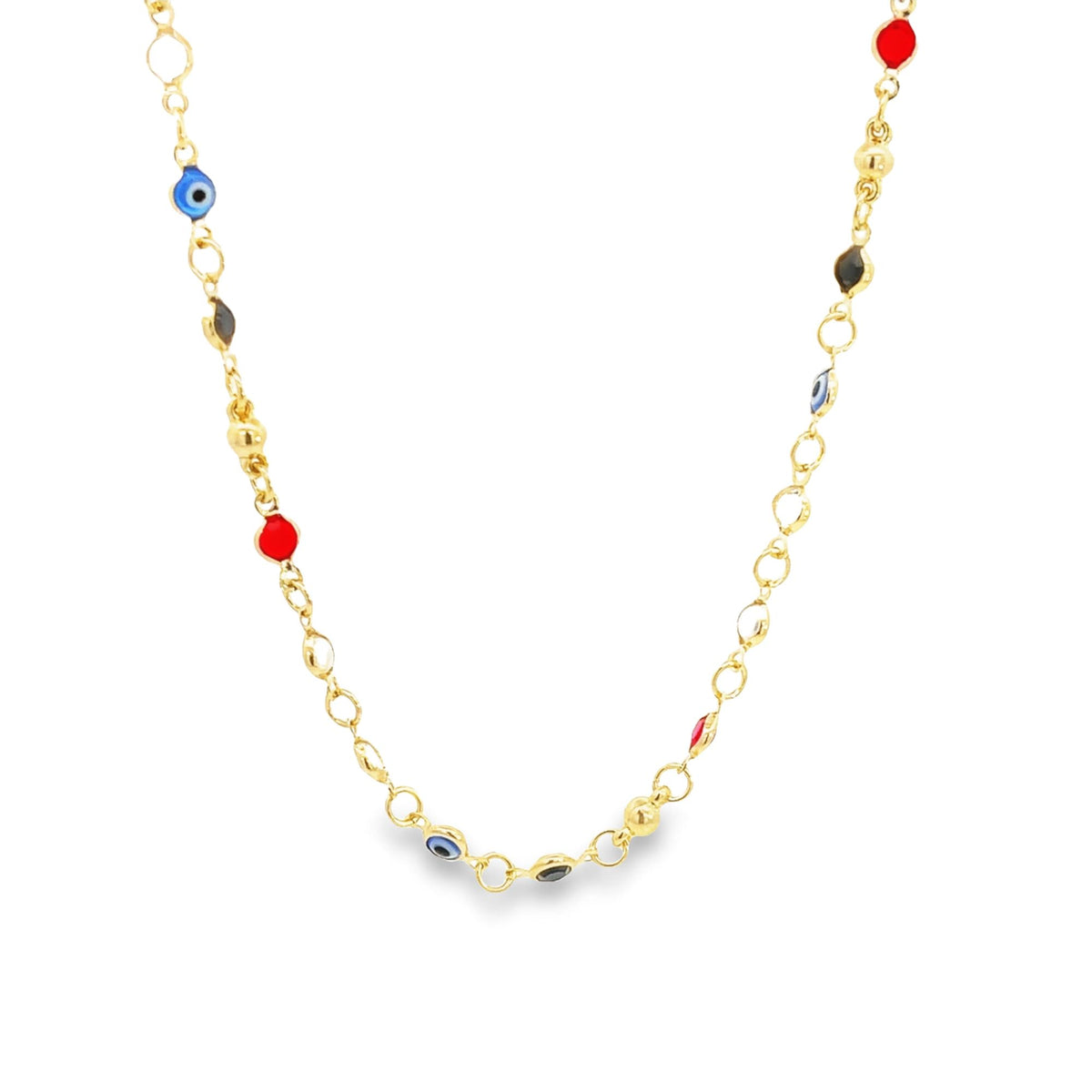 A delicate gold chain necklace drapes against a white background, featuring colorful evil eye beads and red and black enamel charms.