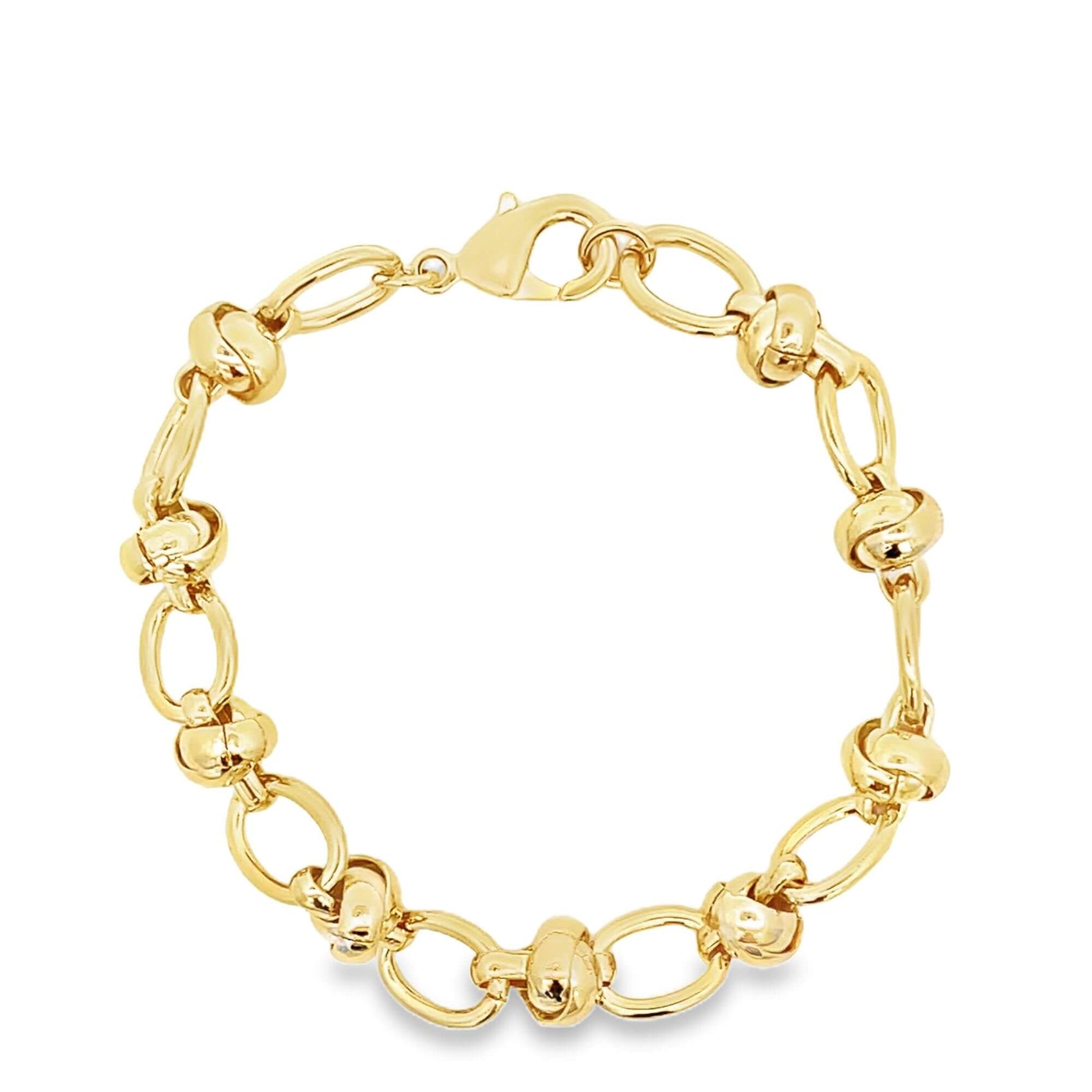 A polished yellow gold link bracelet features alternating smooth oval loops and textured knotted station accents against a clean white background.