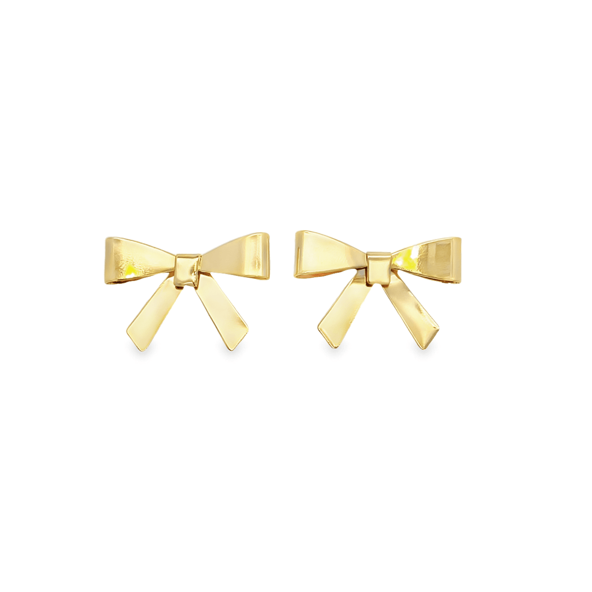 A pair of polished gold bow stud earrings rest against a clean white background.