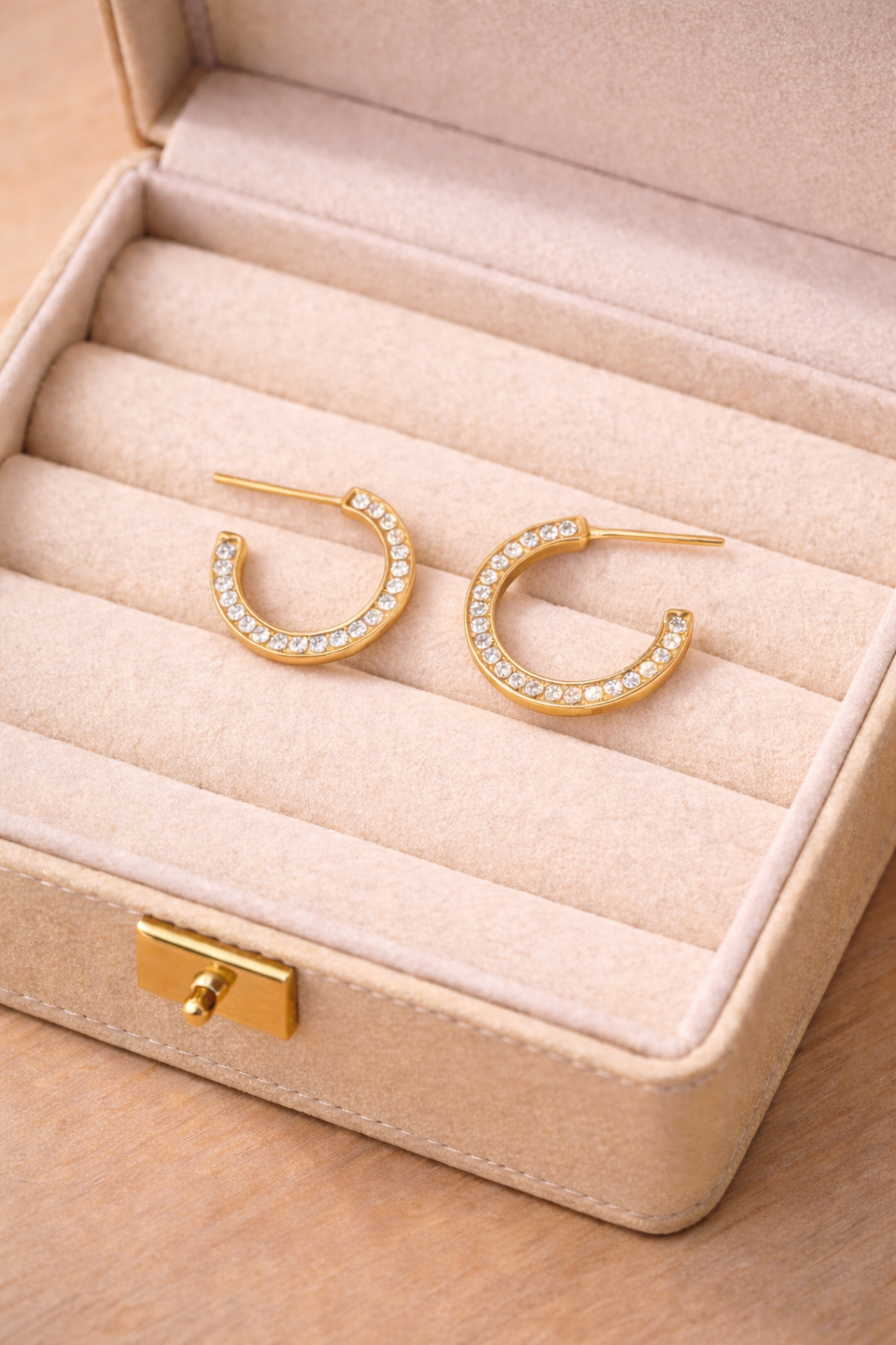 Modern pavé open hoop earrings with CZ stones. Minimalist half hoop design Perfect for everyday wear or layering.