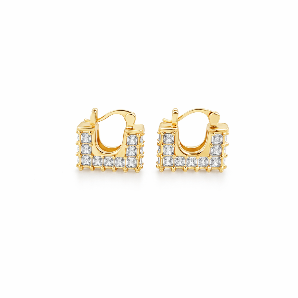 Modern square huggie hoop earrings with baguette-style CZ stones. Geometric U-shape design available in gold or silver. Perfect for stacking or everyday wear.