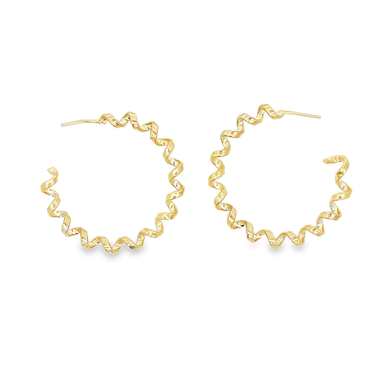 A pair of shiny gold spiral hoop earrings displays a unique zigzag design against a clean white background.