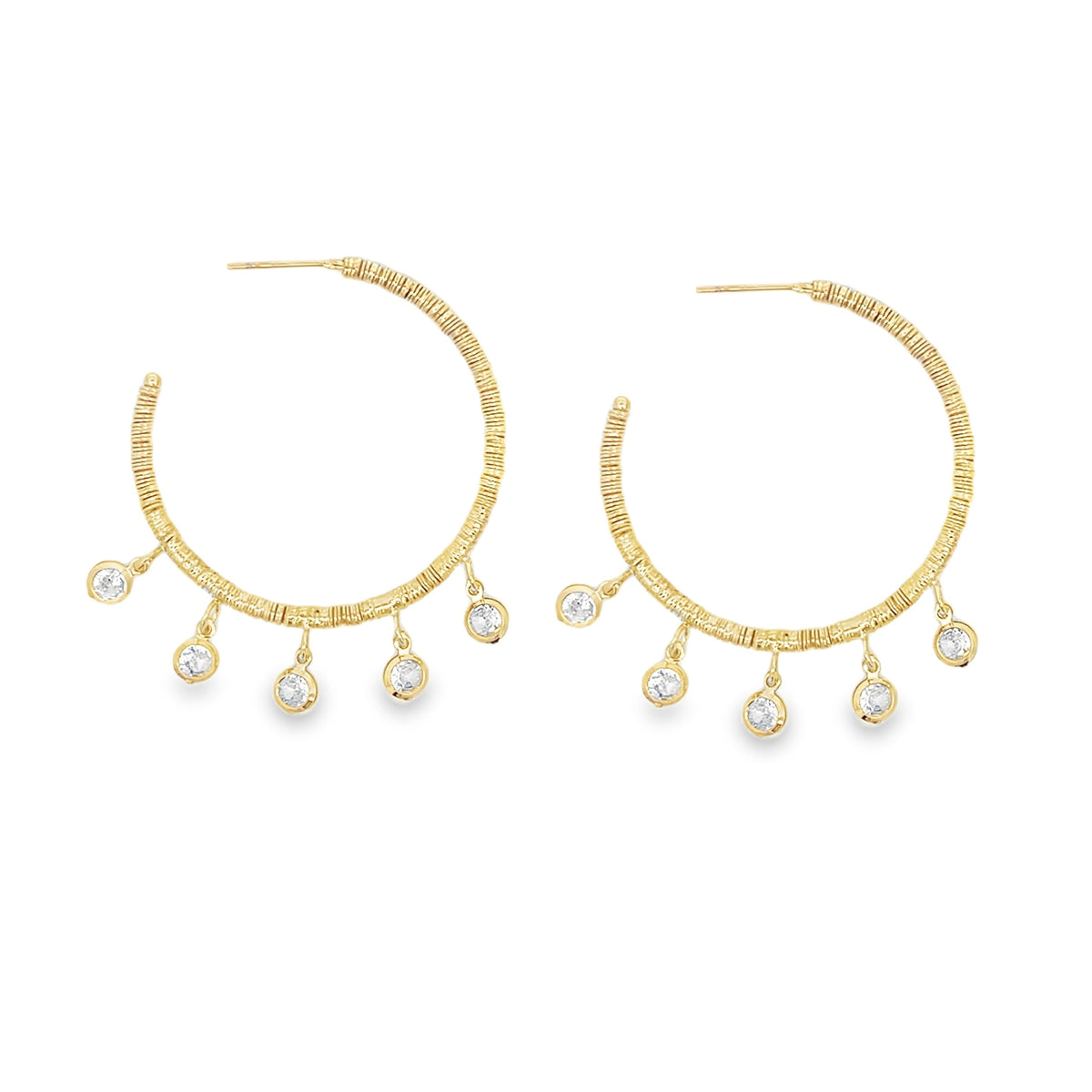 A pair of gold-plated hoop earrings features textured, wrapped metal bands dangling with sparkling bezel-set crystal charms against a clean white background.