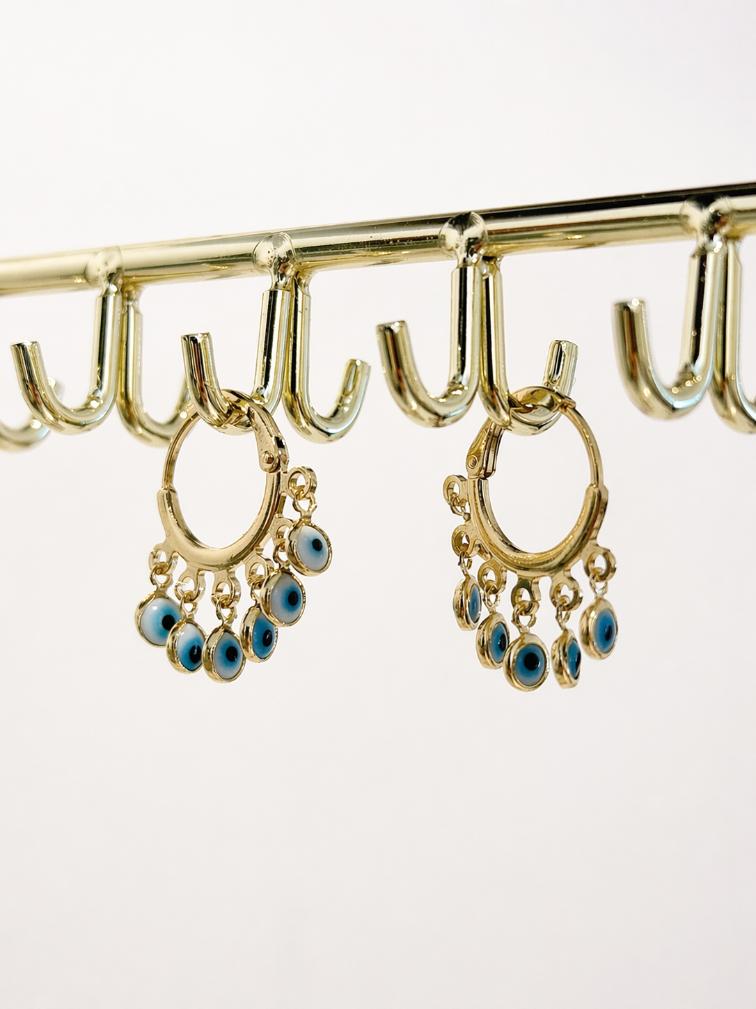 Stylish 18K gold filled evil eye charm earrings. Tarnish-resistant, lightweight and perfect for everyday wear with a meaningful touch.