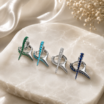 Premium Gold Filled spike huggie earrings featuring brilliant cubic zirconia. Available in Emerald Green, Turquoise, Clear, and Sapphire Blue for a modern everyday look.