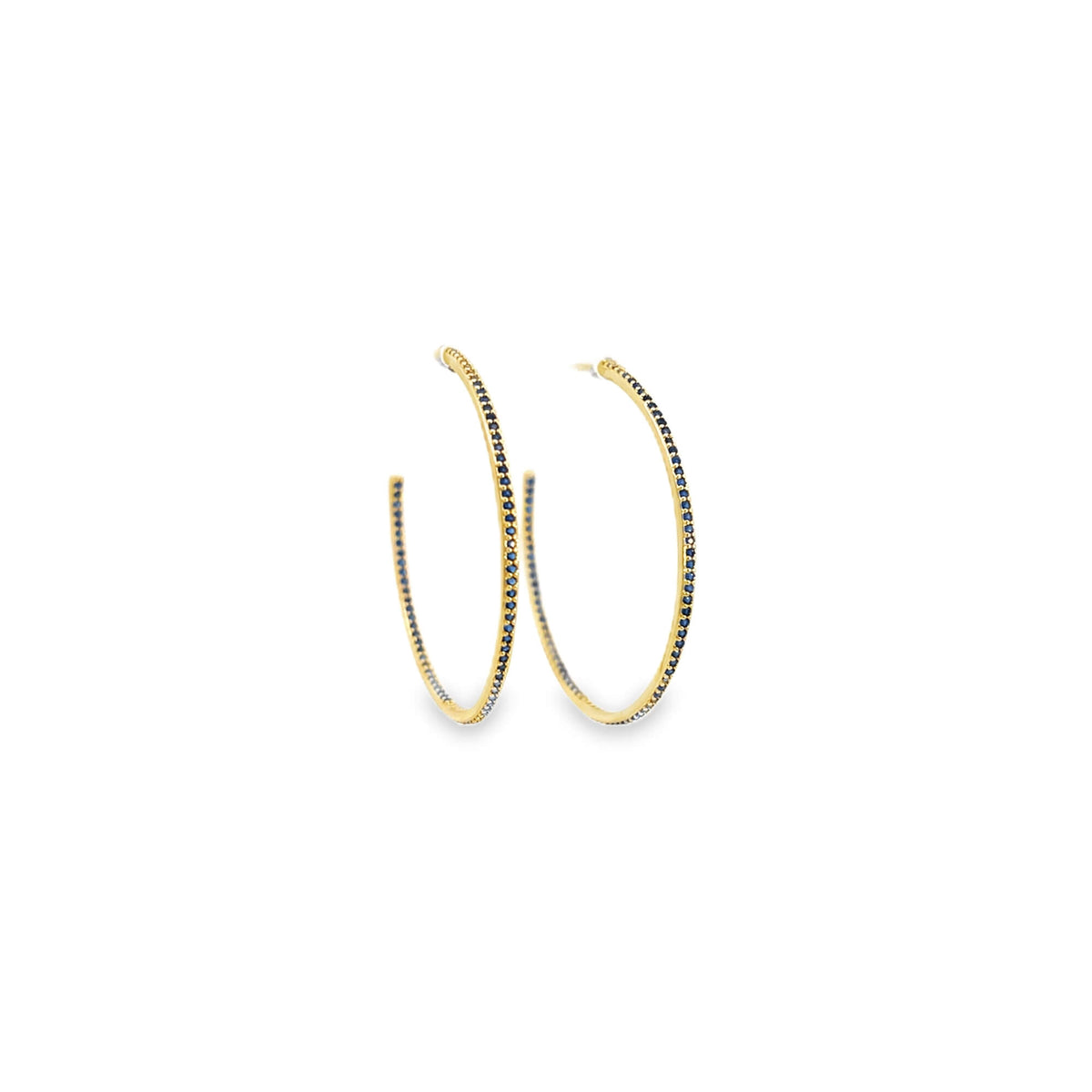 A pair of elegant gold hoop earrings features a sparkling row of pavé-set blue sapphires.