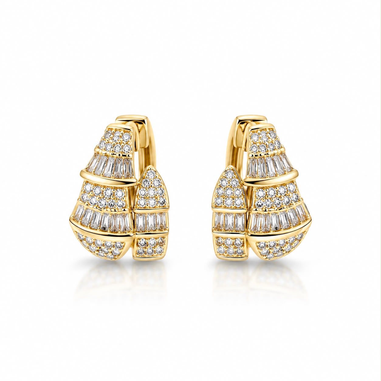 Shop elegant pave hoop earrings featuring baguette-cut and round cubic zirconia stones in a dimensional geometric design. 18K Gold Filled.
