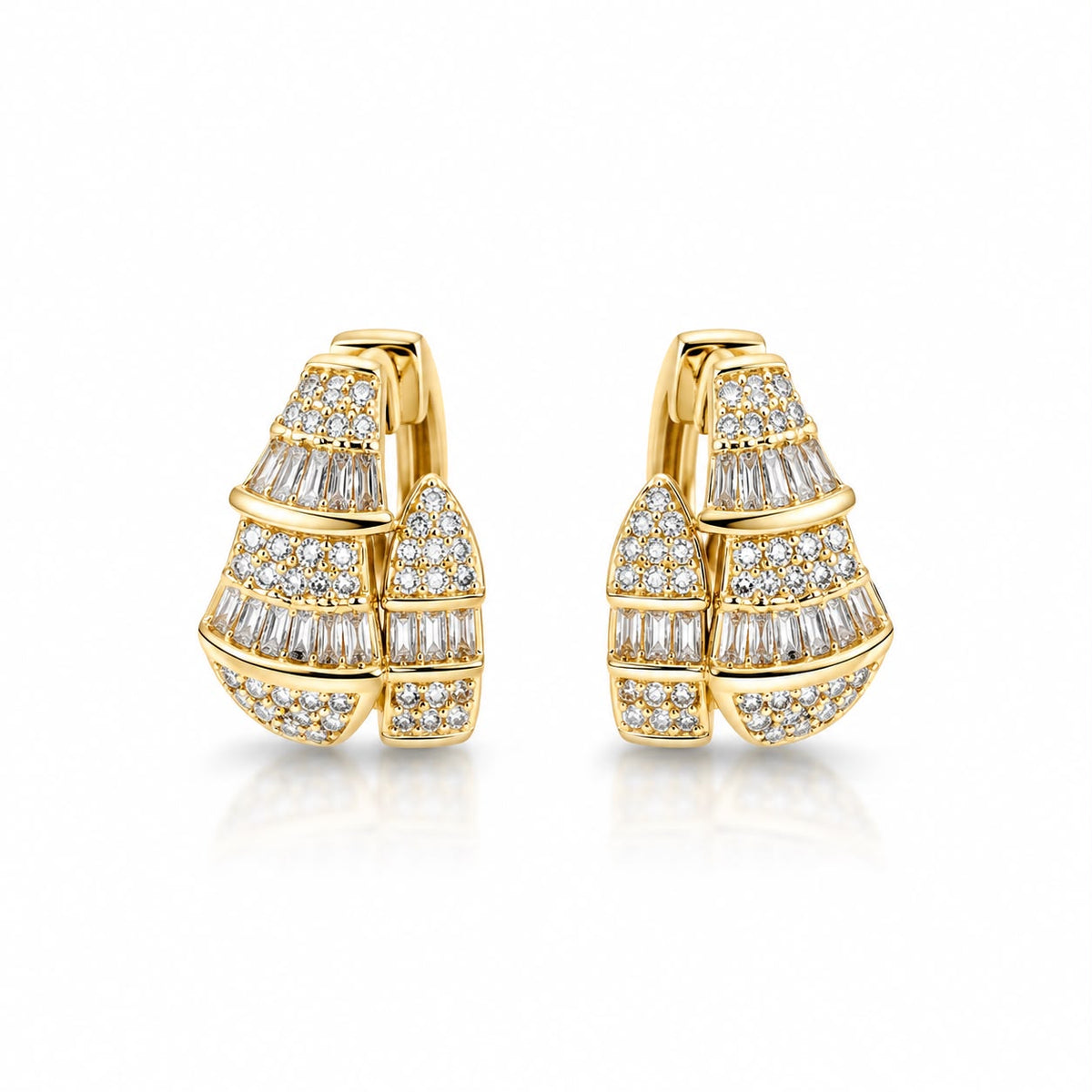 Shop elegant pave hoop earrings featuring baguette-cut and round cubic zirconia stones in a dimensional geometric design. 18K Gold Filled.