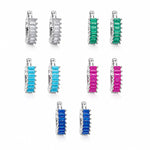Elegant 18K Gold Filled huggie hoop earrings featuring baguette-cut cubic zirconia. Available in clear, emerald, turquoise, sapphire blue and fuchsia. Perfect for everyday wear.