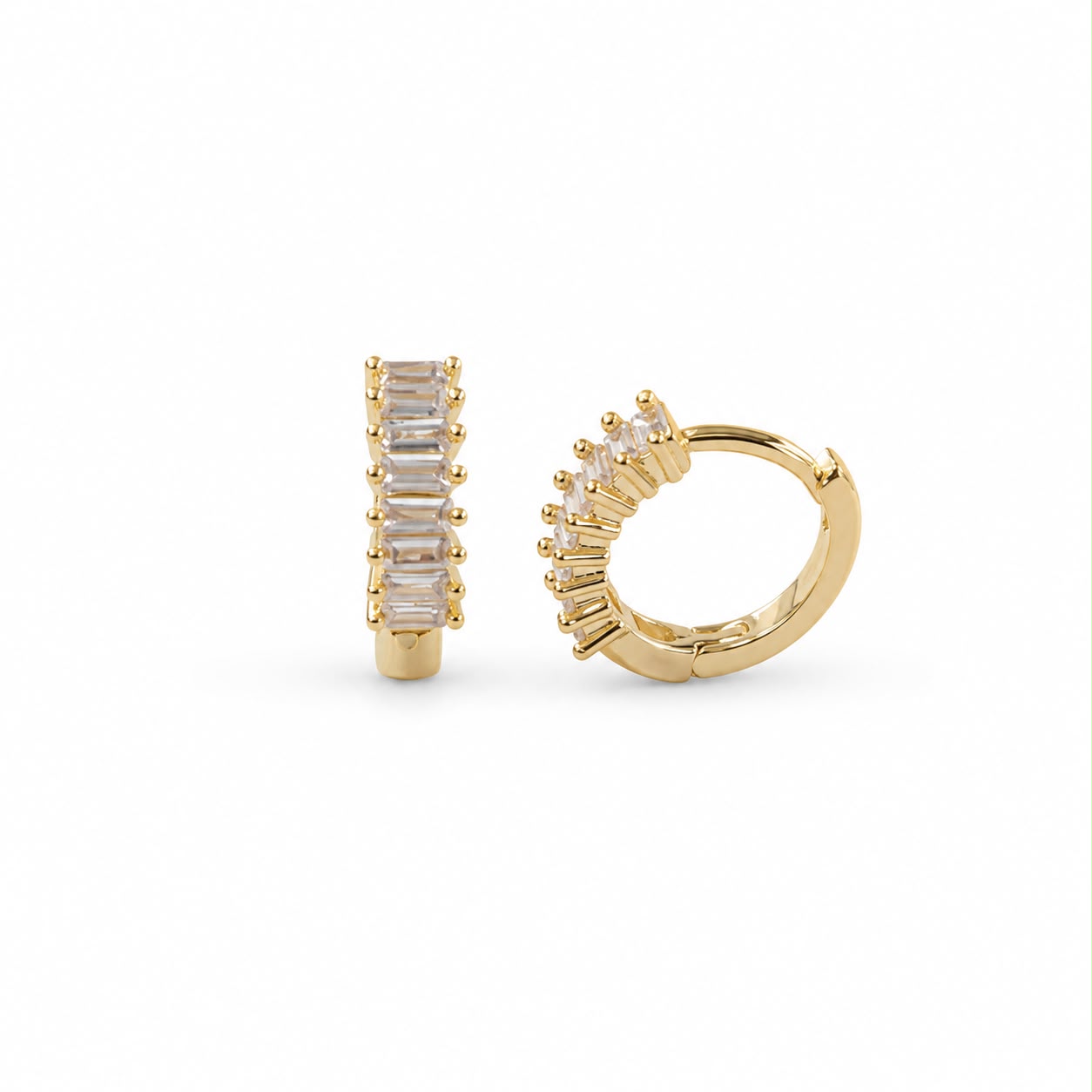 Elegant 18K Gold Filled huggie hoop earrings featuring baguette-cut cubic zirconia. Available in clear, emerald, turquoise, sapphire blue and fuchsia. Perfect for everyday wear.