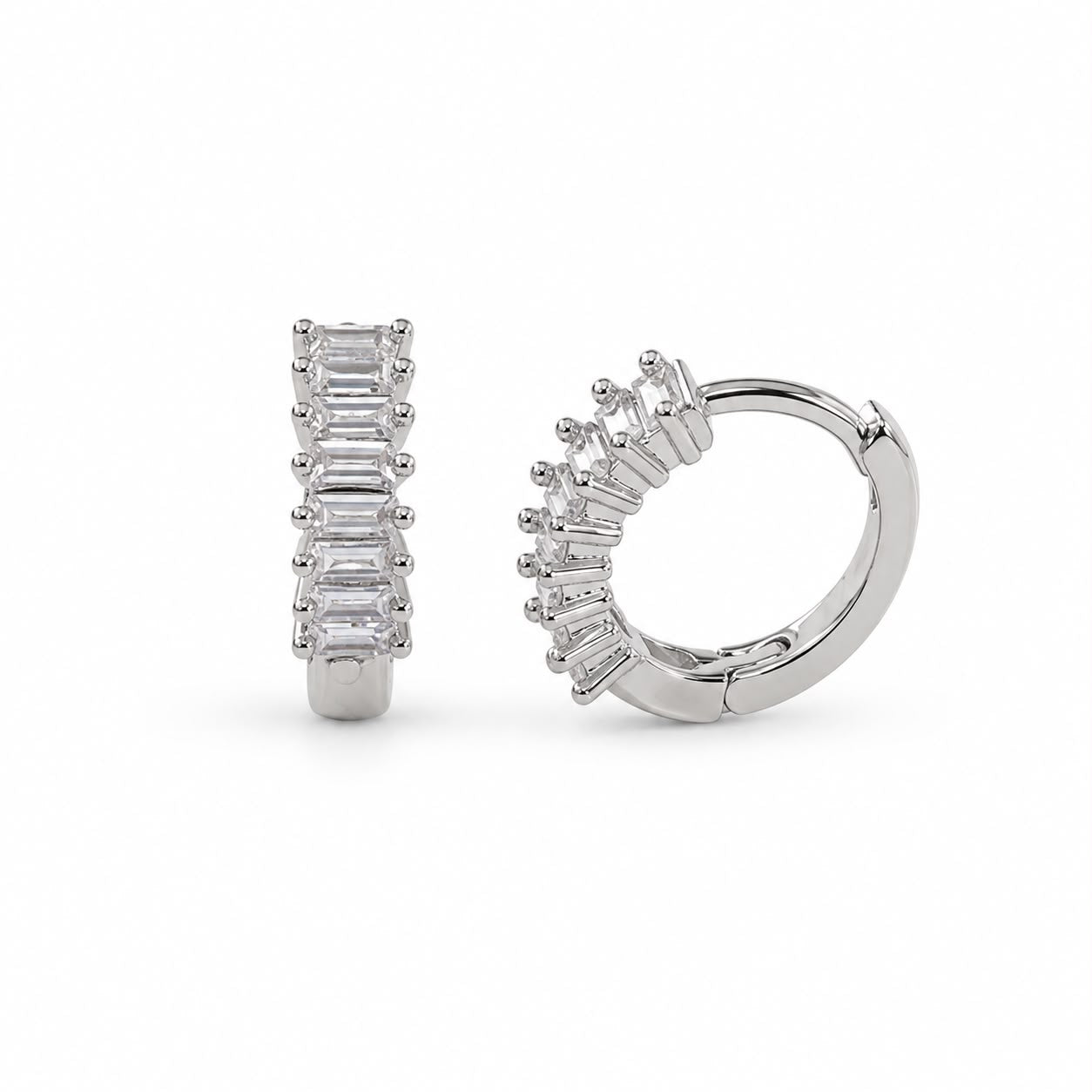 Elegant 18K Gold Filled huggie hoop earrings featuring baguette-cut cubic zirconia. Available in clear, emerald, turquoise, sapphire blue and fuchsia. Perfect for everyday wear.