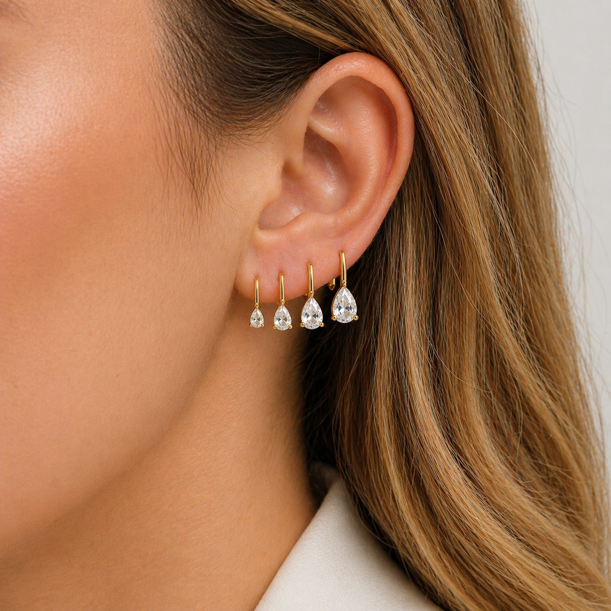 Elegant 18K gold filled pear drop earrings with a minimalist design.  lightweight and perfect for everyday wear or special occasions.