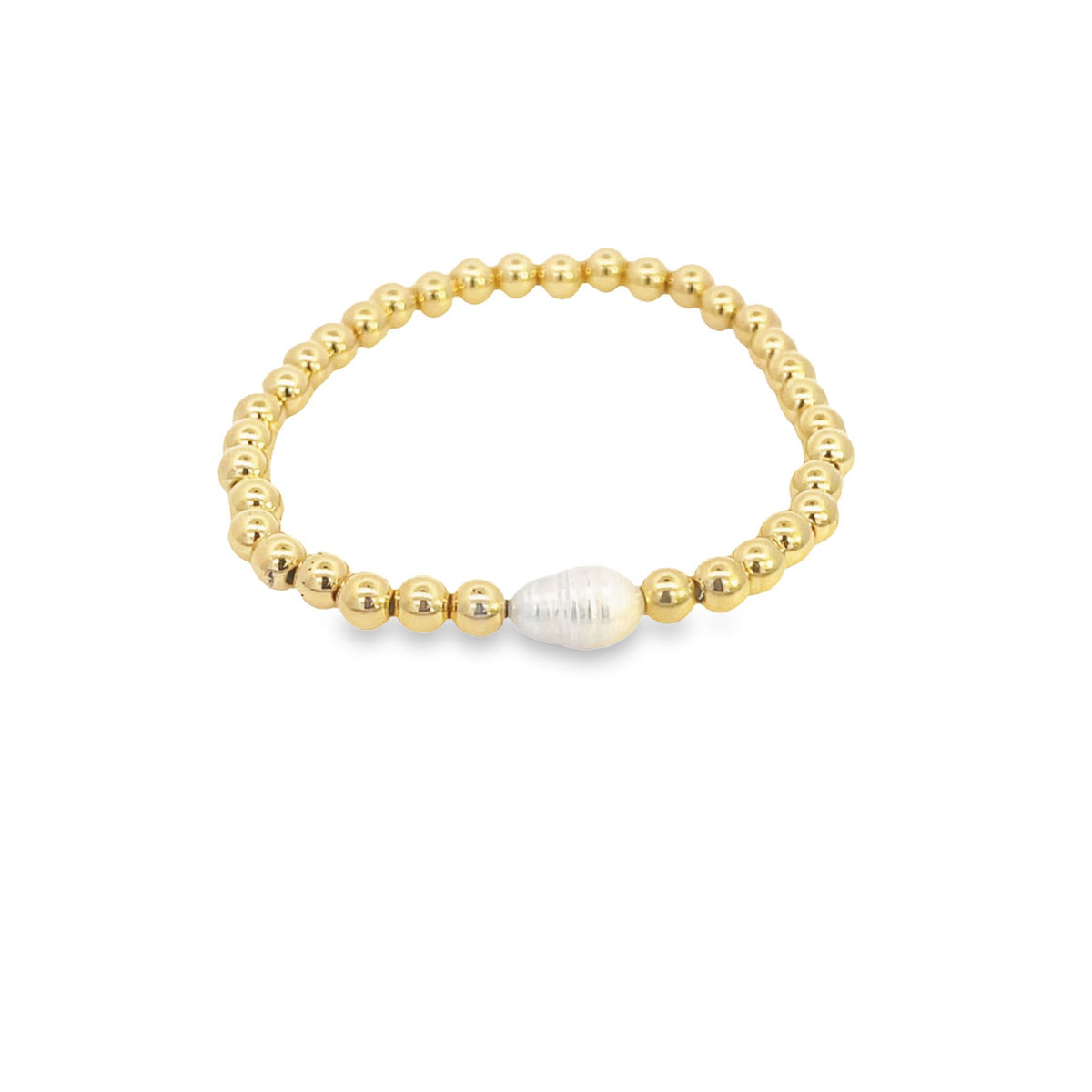 A gold bead stretch bracelet features a central baroque freshwater pearl against a clean white background.