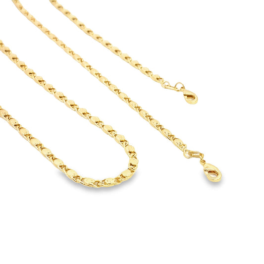 A delicate gold chain necklace with a textured link design rests on a white background, highlighting its lobster clasp.