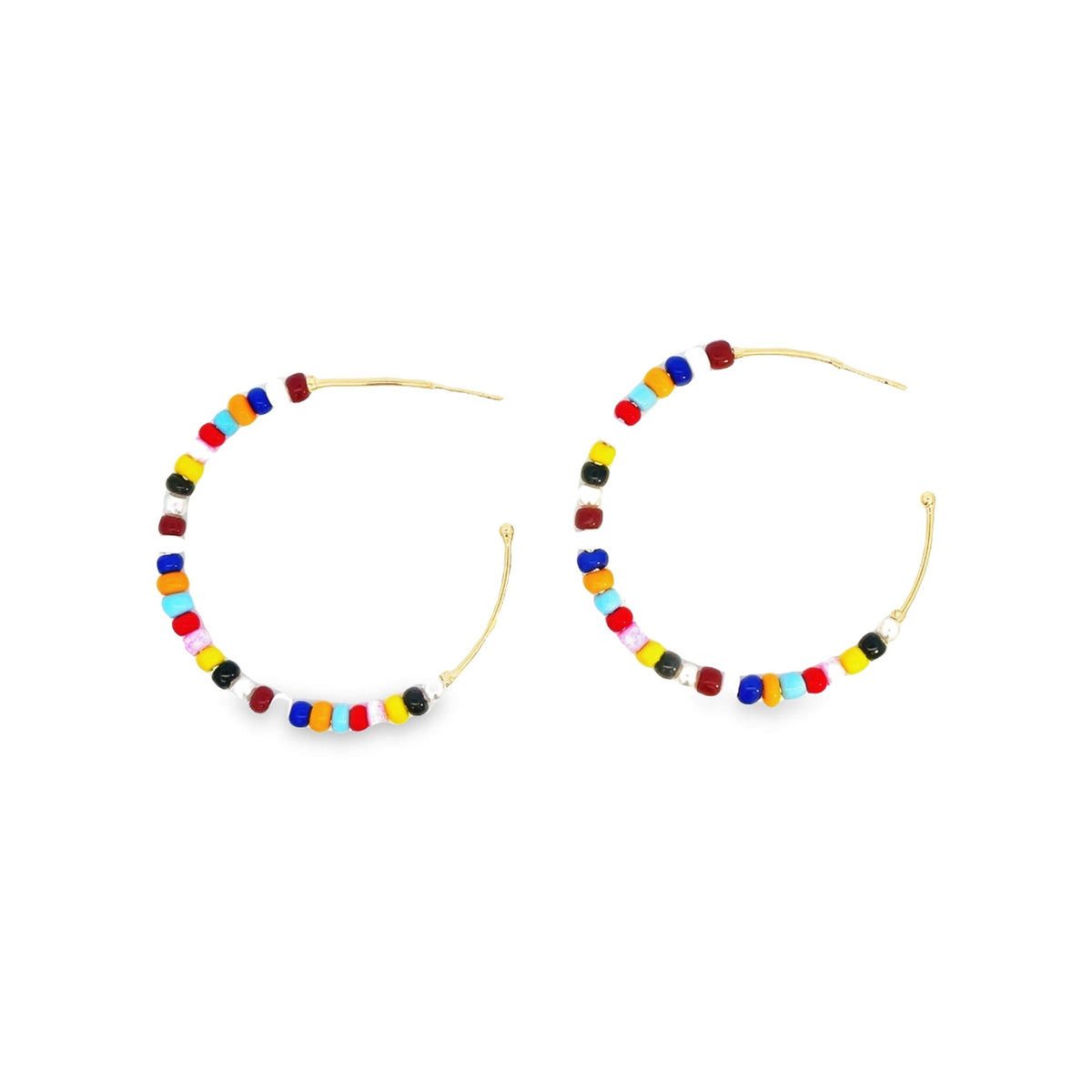 A pair of gold hoop earrings features vibrant multicolored seed beads threaded along the wire against a clean white background.