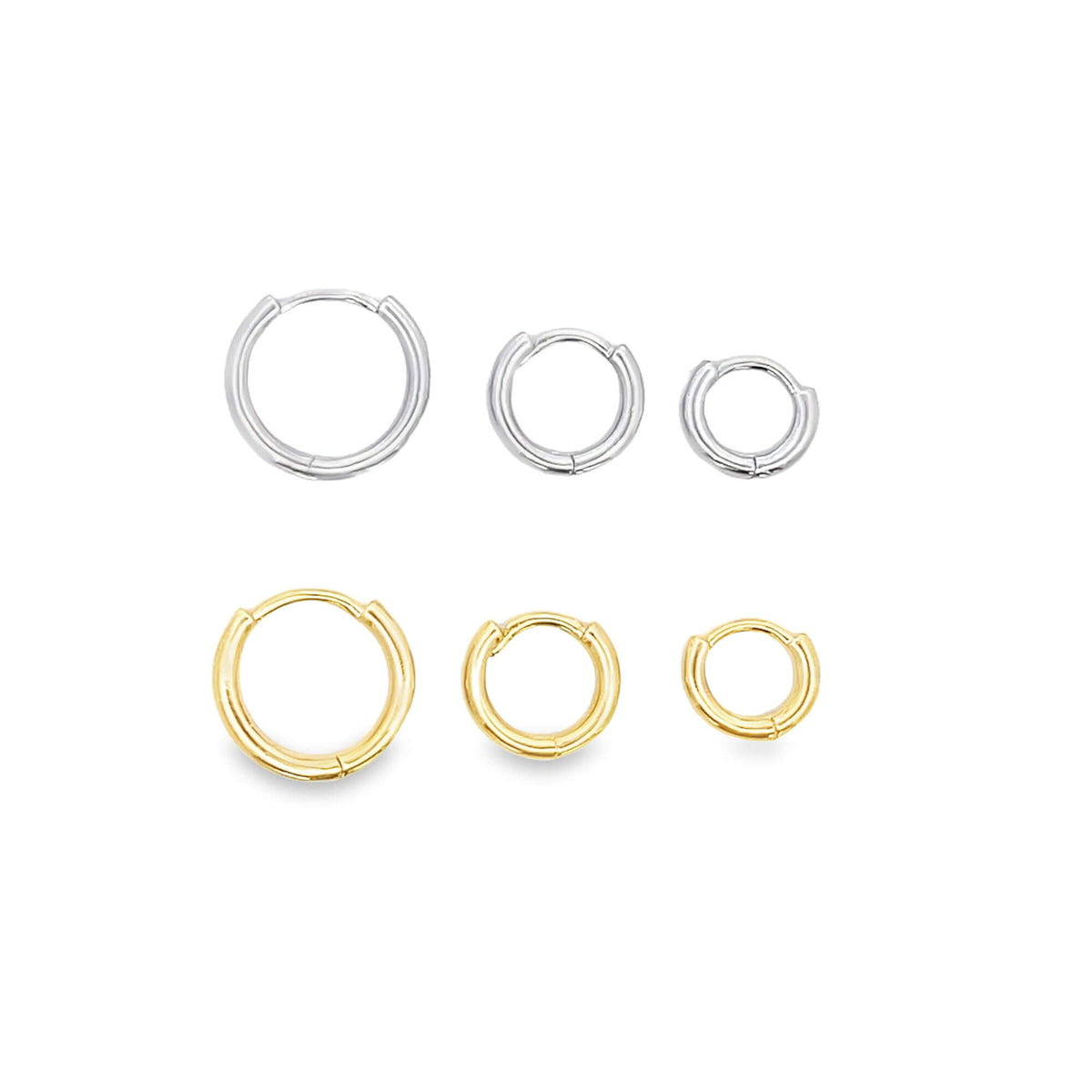A collection of six small silver and gold hoop earrings in descending sizes is displayed in two neat rows against a clean white background.