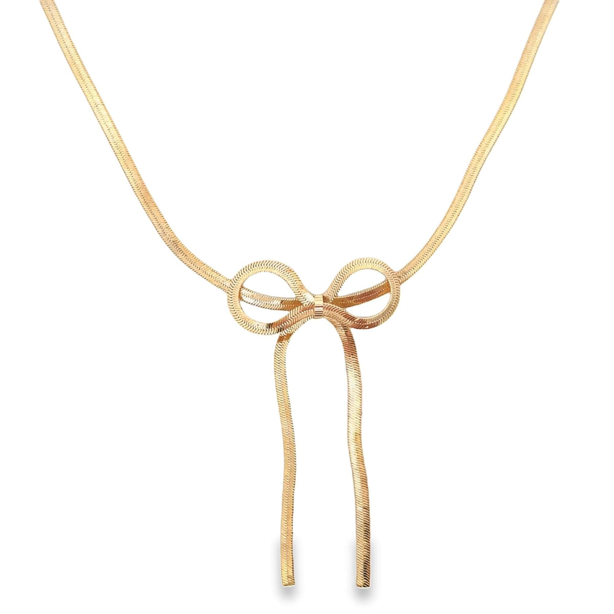 A delicate gold herringbone chain necklace features a stylish bow pendant hanging against a plain white background.