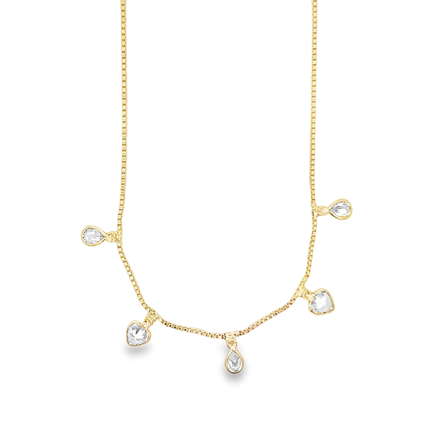A delicate gold box chain necklace dangles charming crystal charms shaped like hearts and teardrops.