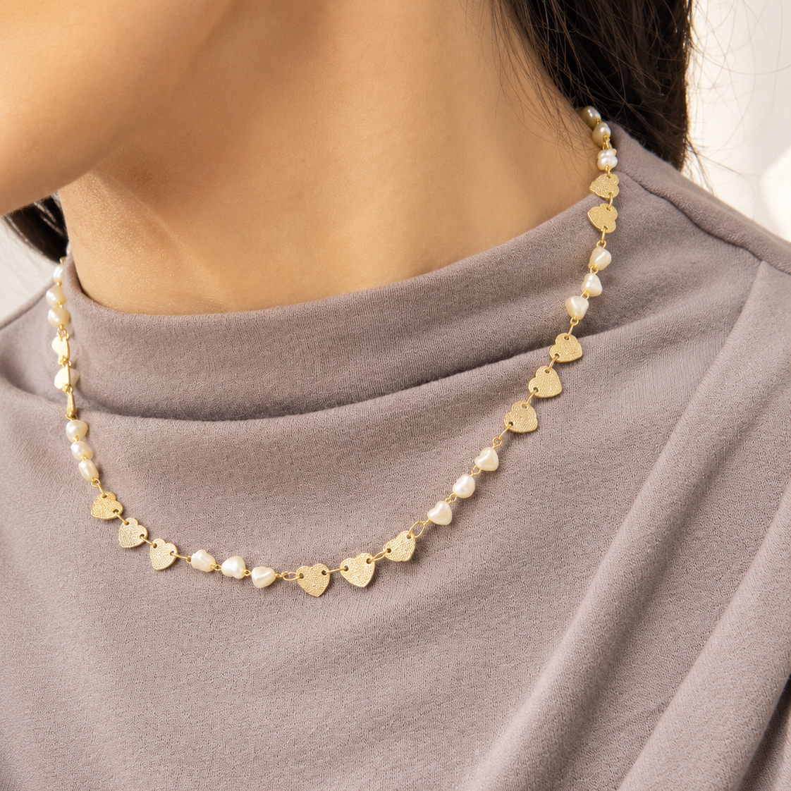 Elegant 18K Gold Filled station necklace featuring textured heart charms and heart-shaped synthetic pearls. Lightweight, feminine and perfect for everyday wear.