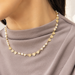 Elegant 18K Gold Filled station necklace featuring textured heart charms and heart-shaped synthetic pearls. Lightweight, feminine and perfect for everyday wear.