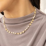 Elegant 18K Gold Filled station necklace featuring textured heart charms and heart-shaped synthetic pearls. Lightweight, feminine and perfect for everyday wear.
