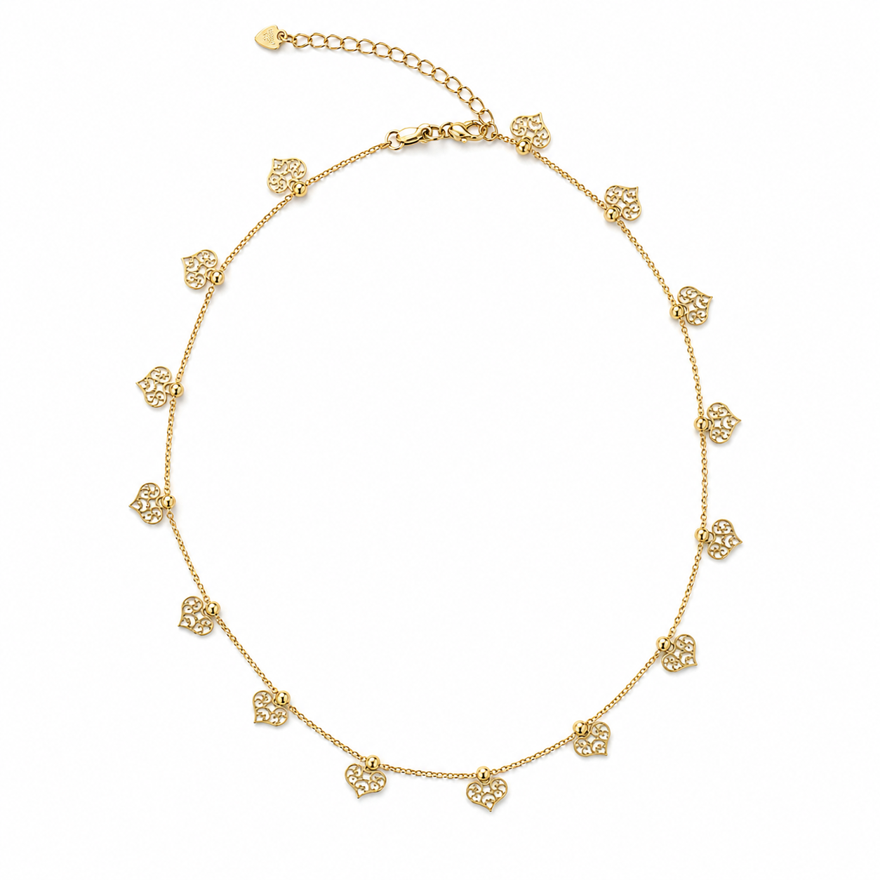A delicate gold chain necklace displays dangling filigree heart charms arranged in a circle on a white background.