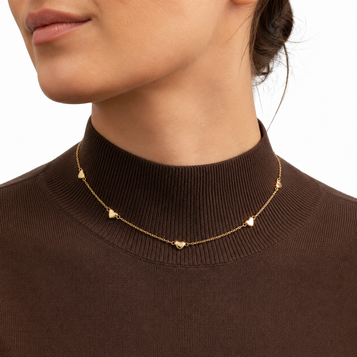 Elegant gold heart station necklace and bracelet set featuring delicate heart charms. Lightweight, minimalist, and perfect for everyday wear or gifting.